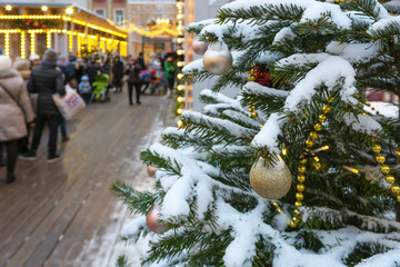 Christmas trees decorated with balls and garlands. Christmas and New year fair in Moscow, Russia