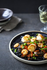 Squid ink pasta with prawns and scallops