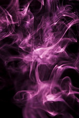 Obraz premium Purple smoke on black background