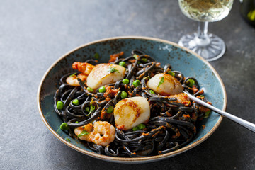 Squid ink pasta with prawns and scallops