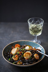 Squid ink pasta with prawns and scallops