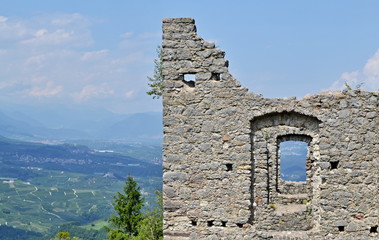 Castle ruins - detail of destroyed stone wall with number of concentric windows