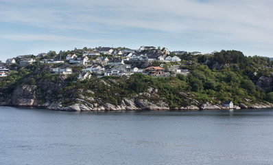 Fototapeta na wymiar Country houses on a hill near Bergen, Norway