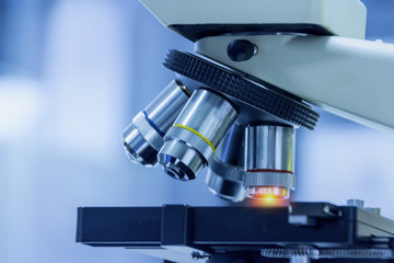  Close-up shot of microscope equipment with metal lens at microbiologal laboratory