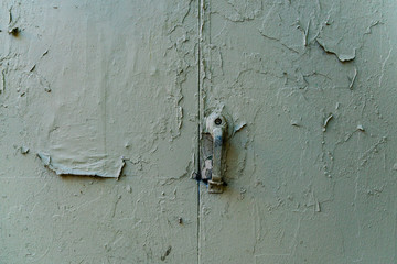 Rusty old green door with lock