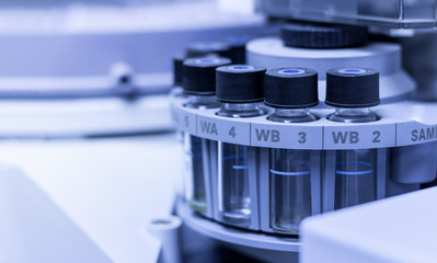 Quality Control Laboratory medicine by equipment. Vials on autosampler of gas chromatography-mass spectrophotometer.