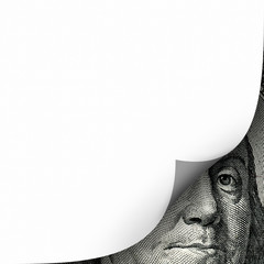 Conceptual finance image of white empty page curl over one hundred dollar bill of US currency