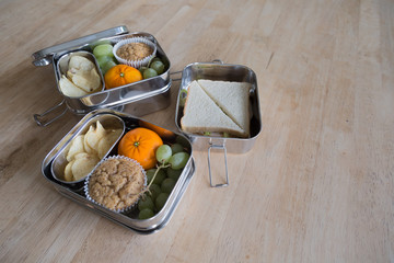 zero waste lunch boxes - stainless steel with a child's packed lunch in it for school