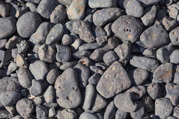 close up of rocks and stones on a beach 
