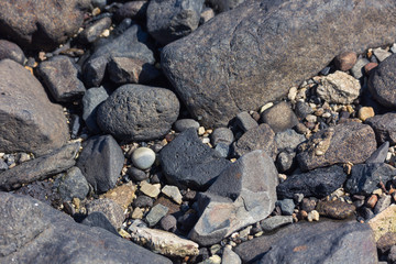 close up of rocks and stones on a beach 
