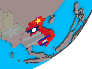 Indochina with national flags on blue political 3D globe.