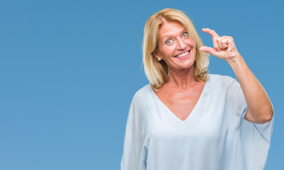 Fototapeta premium Middle age blonde business woman over isolated background smiling and confident gesturing with hand doing size sign with fingers while looking and the camera. Measure concept.