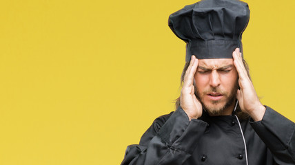 Young handsome cook man with long hair over isolated background with hand on head for pain in head because stress. Suffering migraine.