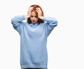 Naklejka premium Young beautiful woman over isolated background wearing winter sweater suffering from headache desperate and stressed because pain and migraine. Hands on head.