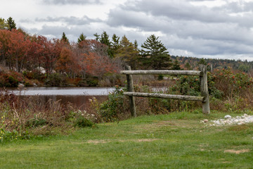 autumn in the park, wooden fence, cloudy sky