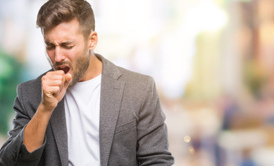 Naklejka premium Young handsome business man over isolated background feeling unwell and coughing as symptom for cold or bronchitis. Healthcare concept.