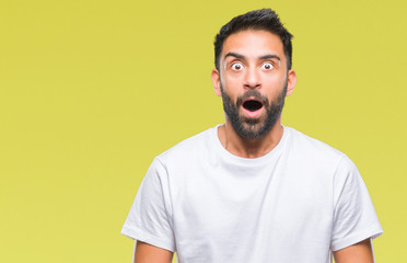 Adult hispanic man over isolated background afraid and shocked with surprise expression, fear and excited face.