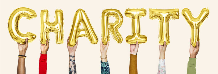 Yellow gold balloons forming the word charity