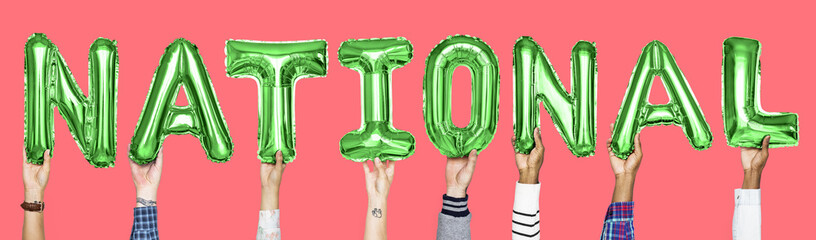 Green alphabet balloons forming the word national