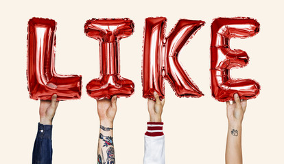 Red alphabet helium balloons forming the text like