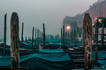 Winter morning in Venice Italy, iconic gondola boats, surreal foggy dramatic photo © chronisyan