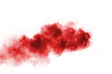 Freeze motion of red powder exploding, isolated on white background. Abstract design of red dust cloud. Particles explosion screen saver, wallpaper