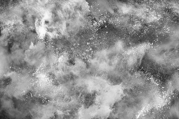 White powder isolated on black background.