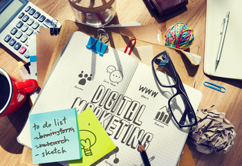 Digital Marketing drawn in a notebook on a messy table