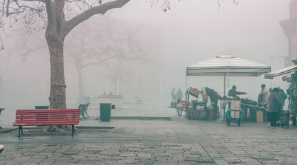 Flea market on Venice Italy on a foggy morning