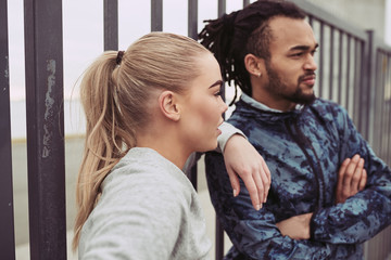 Focused young couple in sportswear ready for a run together