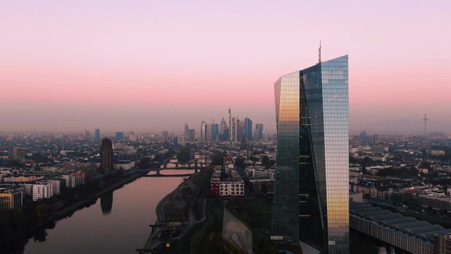Frankfurt ECB Skyline Aerial Shot at early sunrise reflecting sun