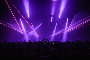 Fototapeta na wymiar Purple concert laser show