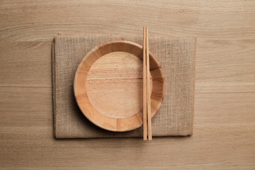 wooden table top with Kitchen ware for background