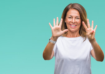 Middle age senior hispanic woman over isolated background showing and pointing up with fingers number nine while smiling confident and happy.