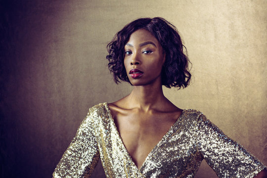 Portrait Of Brunette Woman Wearing Sequin Dress