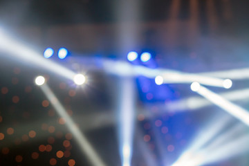 Abstract blurred photo of spotlight in conference hall, seminar and party environment concept