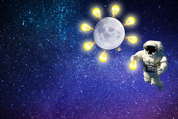 astronaut an electrician replaces a light bulb on moon.space lighting.elements of this image furnished by NASA