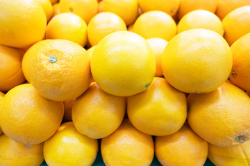 fresh many Orange  fruit , Healthy organic oranges at the market for background .