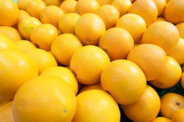 fresh many Orange  fruit , Healthy organic oranges at the market for background .