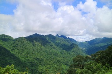 Obraz premium Beautiful landscape view of the mountains with clouds and blue sky in the countryside of Thailand.