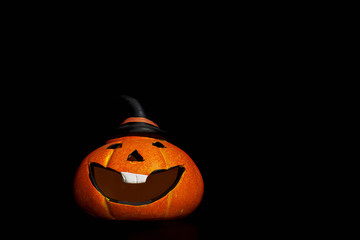 pumpkin on Halloween on a black background, autumn holiday