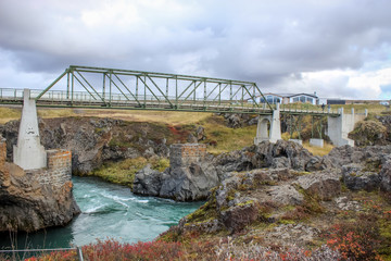 bridge at the Godafoss waterfall in Iceland during the autumn