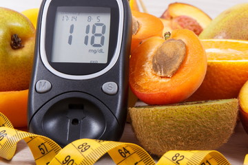 Glucometer for measuring sugar level, centimeter and healthy nutritious food as source vitamins,...