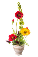 Floral arrangement from artificial poppy flowers in old ceramic flower pot.