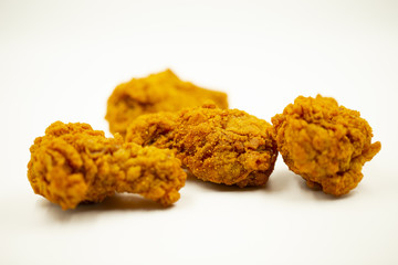 Delicious crispy fried chicken on a white background.
