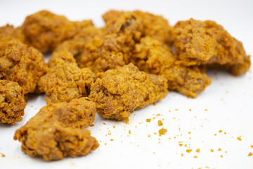 Delicious crispy fried chicken on a white background.