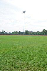 Artificial track and field with green grass combined with artificial grass