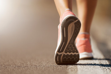 Running shoe closeup of woman running on road with sports shoes - obrazy, fototapety, plakaty
