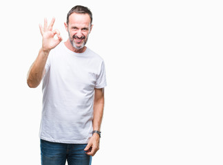Naklejka premium Middle age hoary senior man wearing white t-shirt over isolated background smiling positive doing ok sign with hand and fingers. Successful expression.