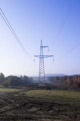 high voltage power lines. horizon line is wrong. electrical distribution station.